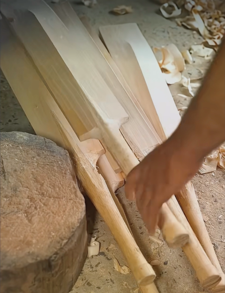 Master craftsman shaping a cricket bat in a Sialkot workshop